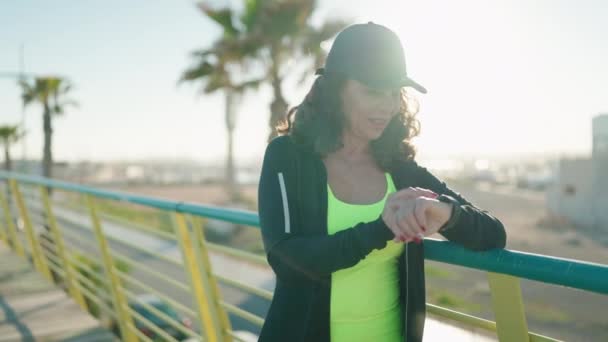 Middle Age Woman Wearing Sportswear Smiling Confident Looking Stopwatch Street — Stockvideo