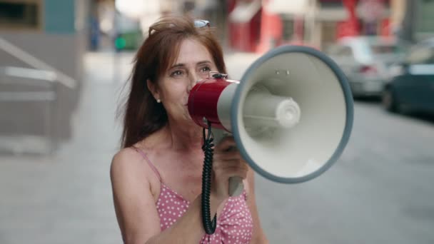 Middle Age Woman Using Megaphone Speaking Street — Stock video
