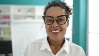 African american woman student smiling confident standing at library university