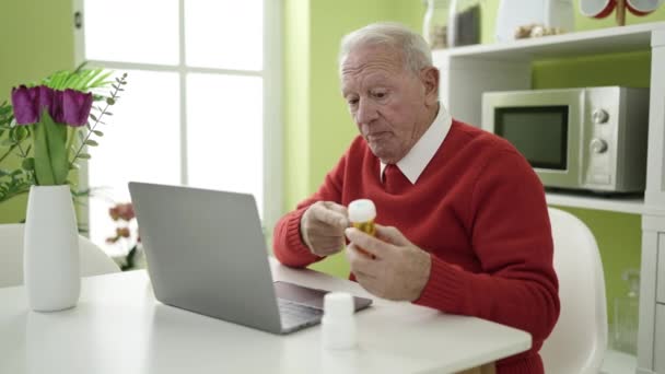 Senior Doing Video Call Doctor Holding Pills Home — Stock Video