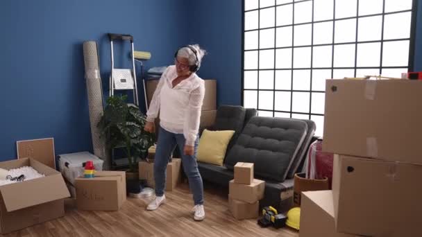 Middle Age Grey Haired Woman Smiling Confident Dancing New Home — Stock Video