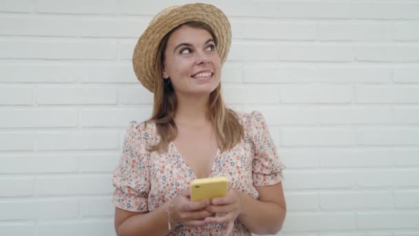 Young Woman Tourist Wearing Summer Hat Using Smartphone Isolated White — Stock Video