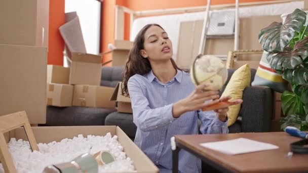 Young Beautiful Hispanic Woman Unpacking Cardboard Box New Home — Wideo stockowe