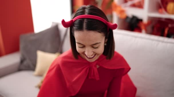 Young Beautiful Hispanic Woman Wearing Devil Costume Using Smartphone Home — Stockvideo