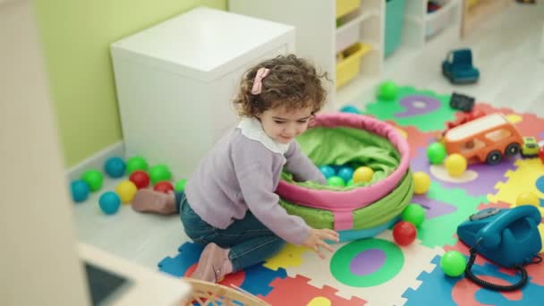 Adorable Hispanic Girl Playing Balls Sitting Floor Kindergarten — Video