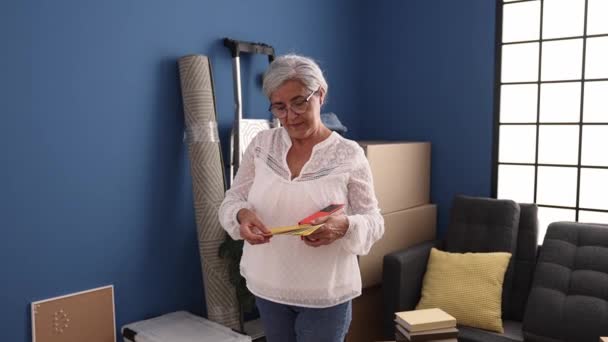Middle Age Grey Haired Woman Choosing Color Paint Wall New — Stock video
