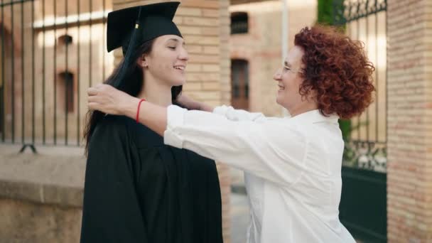 Two Women Mother Daughter Celebrating Graduation Campus University — Stockvideo