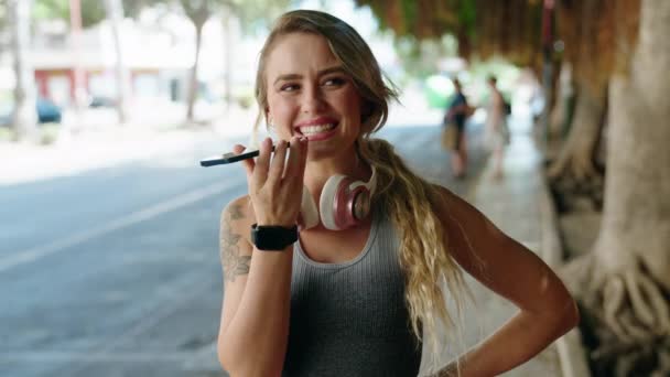 Young Blonde Woman Wearing Sportswear Talking Smartphone Street — Stock Video