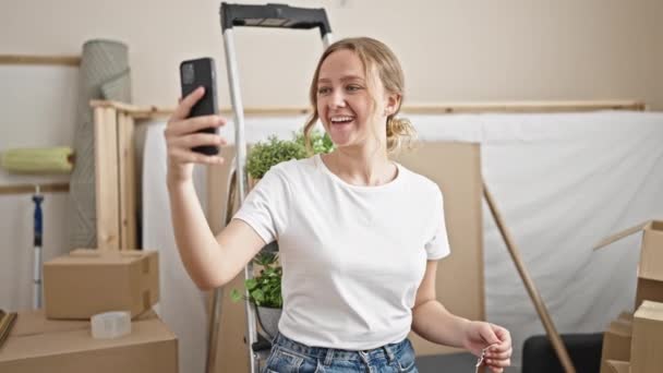 Young Blonde Woman Having Video Call Holding Key New Home — Video Stock
