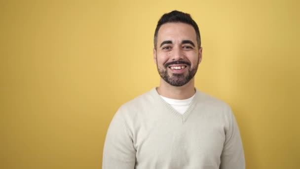 Young Hispanic Man Smiling Confident Pointing Fingers Side Isolated Yellow — Stock Video