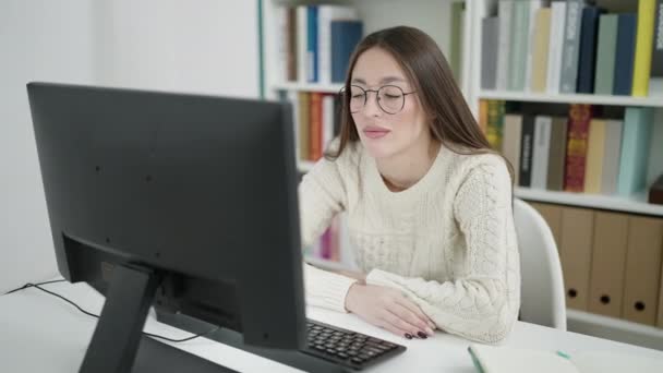 Young Beautiful Hispanic Woman Student Using Computer Stressed Library University — Vídeos de Stock