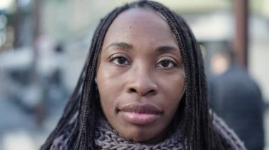 African woman smiling confident at street