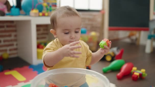 Adorable Hispanic Baby Playing Construction Blocks Sitting Floor Kindergarten — Vídeo de Stock