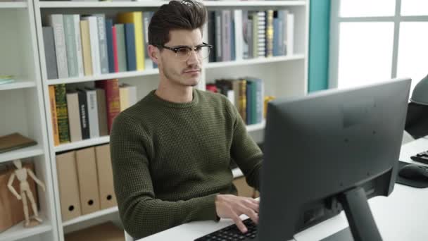 Young Hispanic Man Student Stressed Studying Library University — Stockvideo