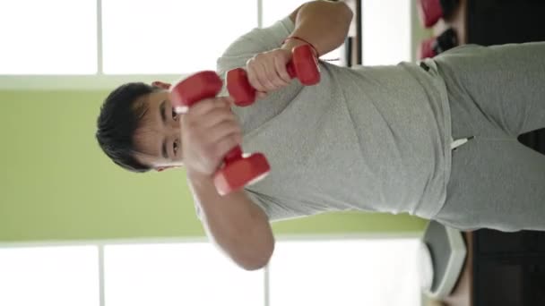Young Chinese Man Using Dumbbells Boxing Sport Center — Stockvideo