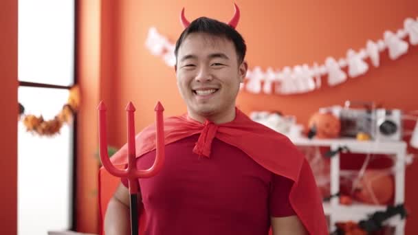 Young Chinese Man Wearing Devil Costume Holding Trident Home — Video Stock