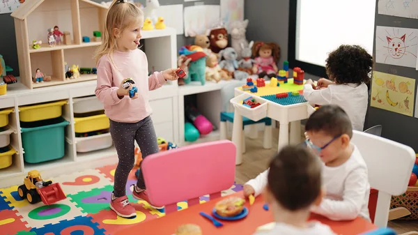 stock image Group of kids students playing with toys at kindergarten