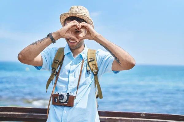 African American Man Tourist Smiling Confident Doing Heart Gesture Seaside — Stock Photo, Image