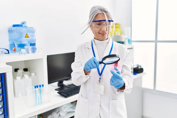 Middle Age Grey Haired Woman Wearing Scientist Uniform Using Magnifying — Stock Photo, Image
