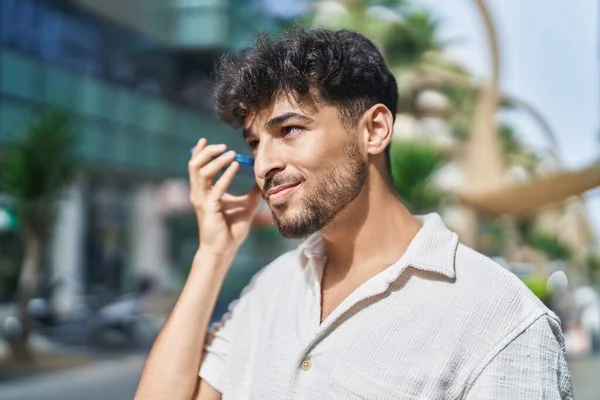 Young Arab Man Smiling Confident Listening Audio Message Smartphone Street — ストック写真