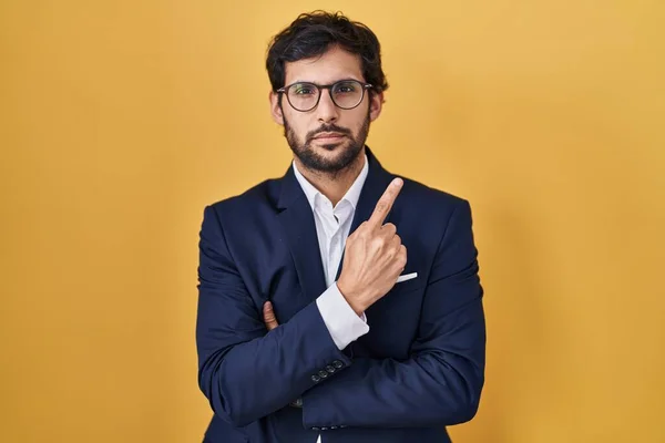 Handsome Latin Man Standing Yellow Background Pointing Hand Finger Side — Stock Photo, Image