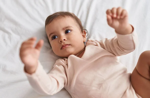 Adorable Hispanic Baby Lying Bed Relaxed Expression Bedroom — Stock Photo, Image