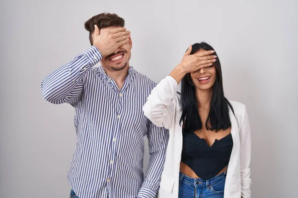 Young Hispanic Couple Standing White Background Smiling Laughing Hand Face — ストック写真