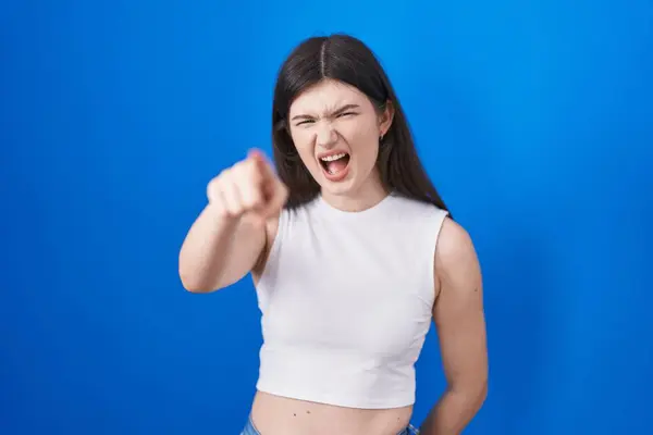 Young Caucasian Woman Standing Blue Background Pointing Displeased Frustrated Camera — Stockfoto