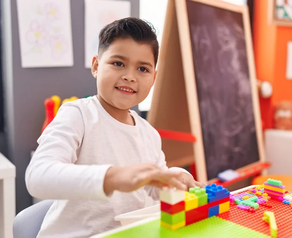 Adorable Hispanic Boy Playing Construction Blocks Sitting Table Kindergarten — 스톡 사진