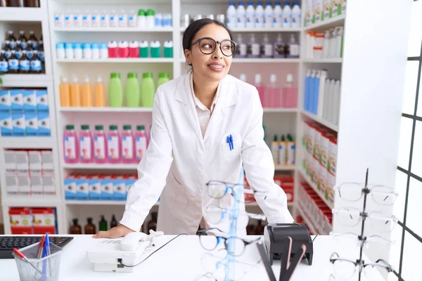 stock image Young arab woman pharmacist smiling confident standing at pharmacy