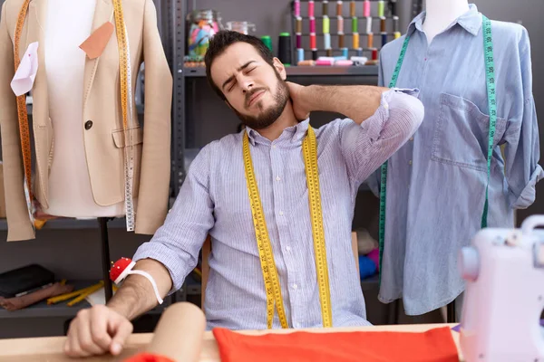 Young Hispanic Man Tailor Stressed Sitting Table Atelier — Stock Photo, Image