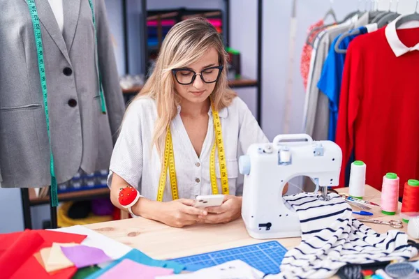 Young Blonde Woman Tailor Using Smartphone Tailor Shop — Stock Photo, Image