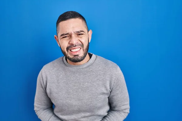 Hispanic Man Standing Blue Background Hand Stomach Because Indigestion Painful — Foto de Stock