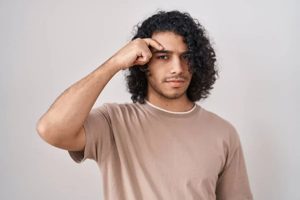 Hispanic Man Curly Hair Standing White Background Pointing Unhappy Pimple — Stock Photo, Image