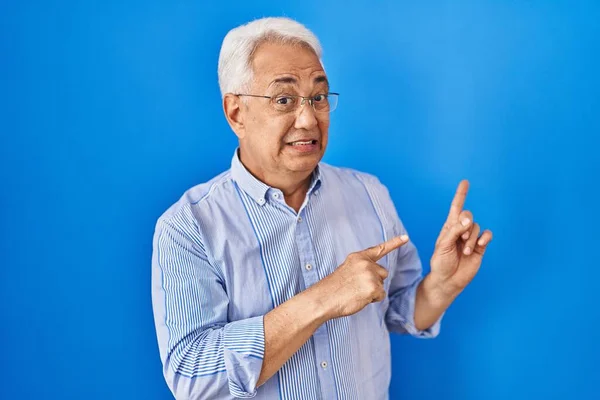 Hispanic Senior Man Wearing Glasses Pointing Aside Worried Nervous Both — Stock Photo, Image