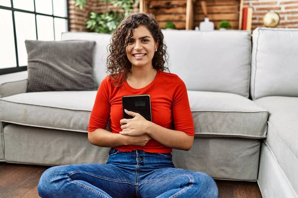 Young Latin Woman Smiling Confident Hugging Bible Home — Φωτογραφία Αρχείου
