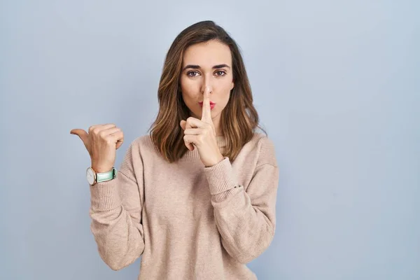 Young Woman Standing Isolated Background Asking Quiet Finger Lips Pointing — Foto de Stock