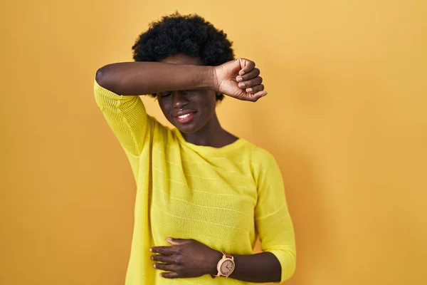 African Young Woman Standing Yellow Studio Covering Eyes Arm Smiling — Stock Photo, Image