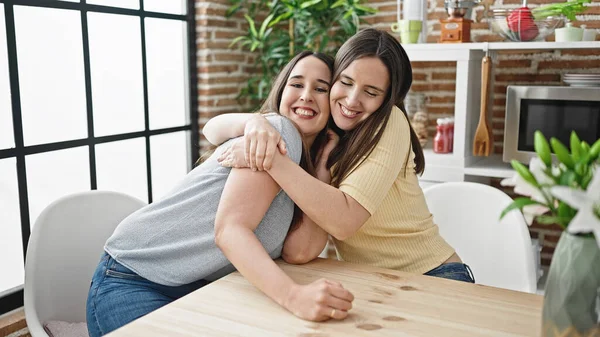 Two Women Hugging Each Other Sitting Table Dinning Room — Stock Photo, Image