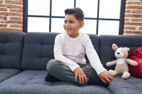 Adorable Hispanic Boy Smiling Confident Sitting Sofa Home — ストック写真