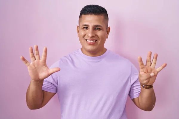 Young Hispanic Man Standing Pink Background Showing Pointing Fingers Number — Fotografia de Stock