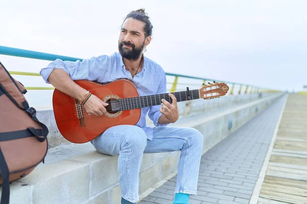 Young Hispanic Man Musician Playing Classical Guitar Sitting Bench Seaside — Foto Stock