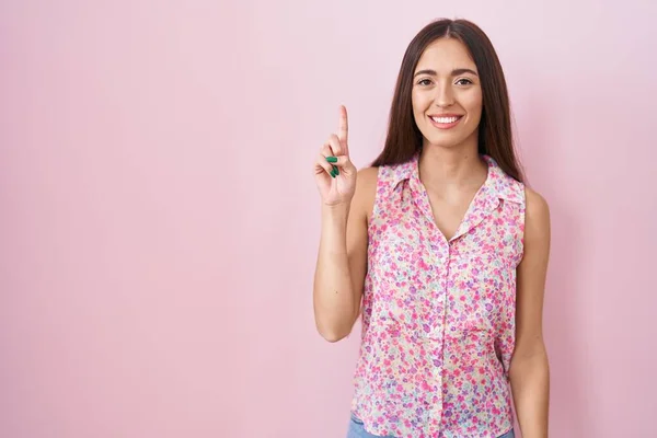 Young Hispanic Woman Long Hair Standing Pink Background Showing Pointing —  Fotos de Stock