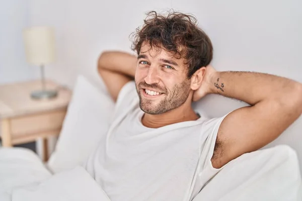 Young Man Smiling Confident Relaxed Bed Bedroom — Foto Stock
