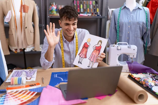 Young Hispanic Man Tailor Having Video Call Showing Clothing Design — Stockfoto