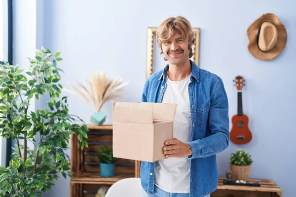 Young Man Smiling Confident Holding Package Home — Stock Photo, Image