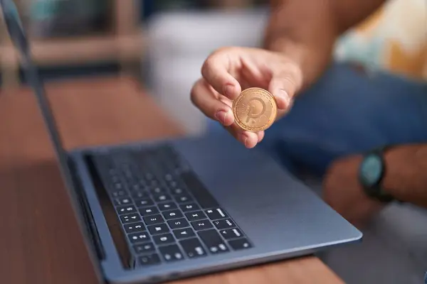 Young Hispanic Man Holding Polkadot Crypto Currency Using Laptop Home — Stock Photo, Image