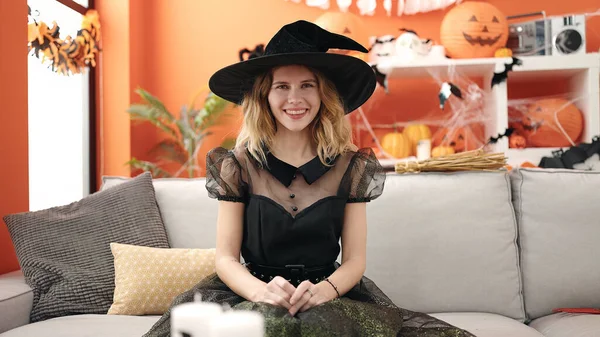 Young Blonde Woman Wearing Halloween Costume Sitting Sofa Home — стоковое фото