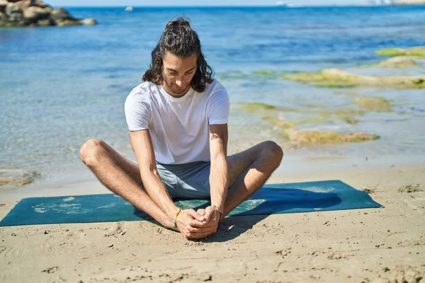 Young Hispanic Man Doing Yoga Exercise Sitting Sand Beach — 图库照片