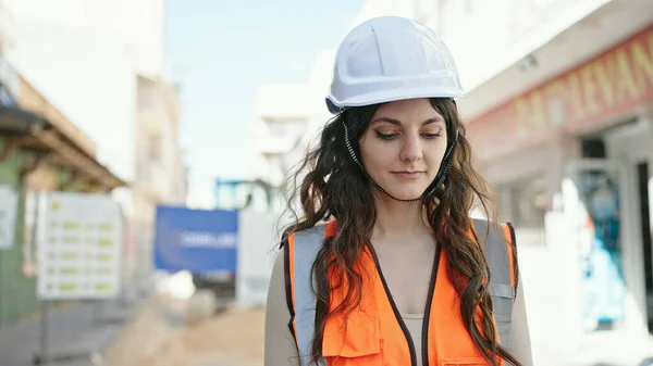 stock image Young beautiful hispanic woman builder standing with relaxed expression at street